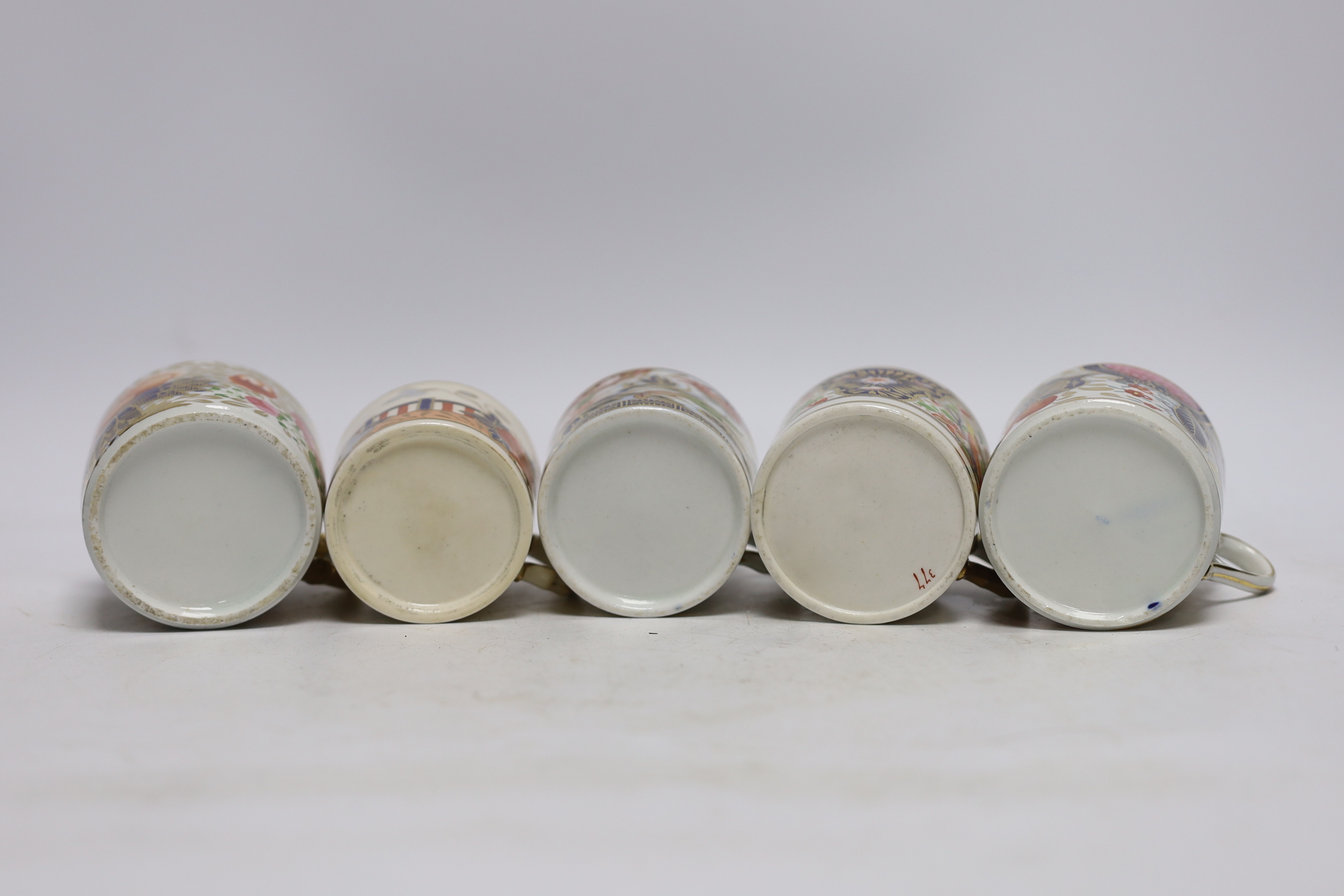 Twelve 1800-1820 English porcelain coffee cans, including Imari pattern examples